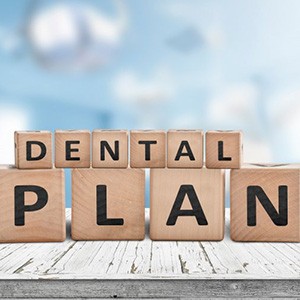Blocks spell out “dental plan”