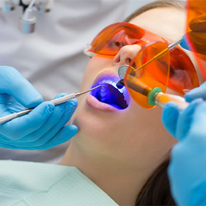 A young woman getting a tooth-colored filling