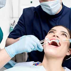 A young woman receiving a dental checkup