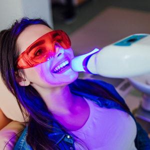 Dental patient getting her teeth professionally whitened